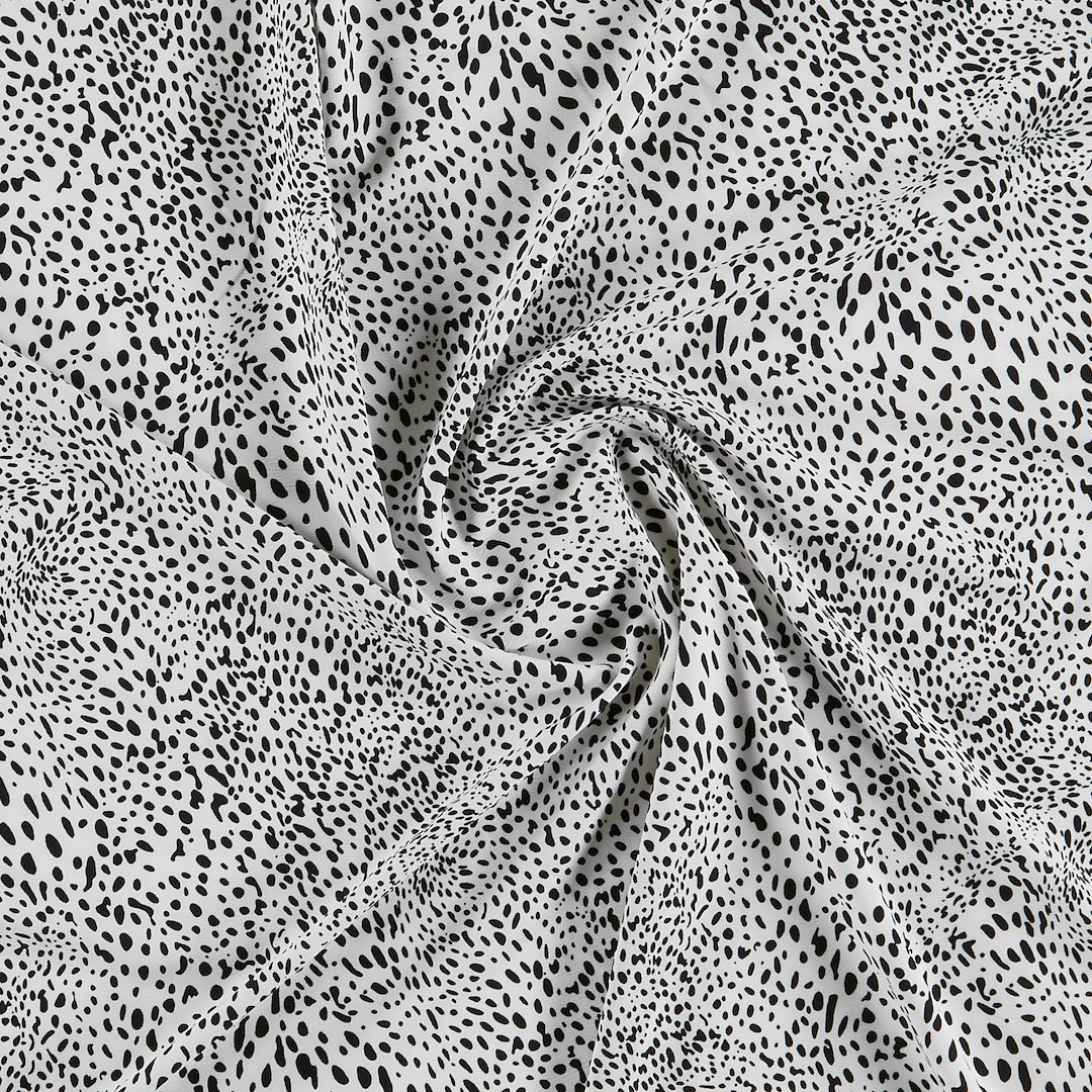 Billede af Vævet crepe stretch hvid m uens prikker