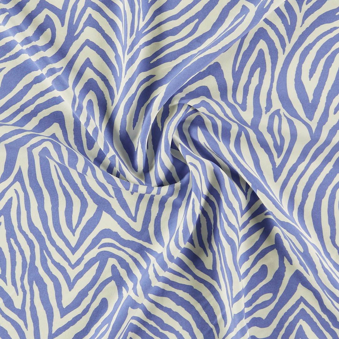 Billede af Vævet viscose twill hvid/blå zebra print
