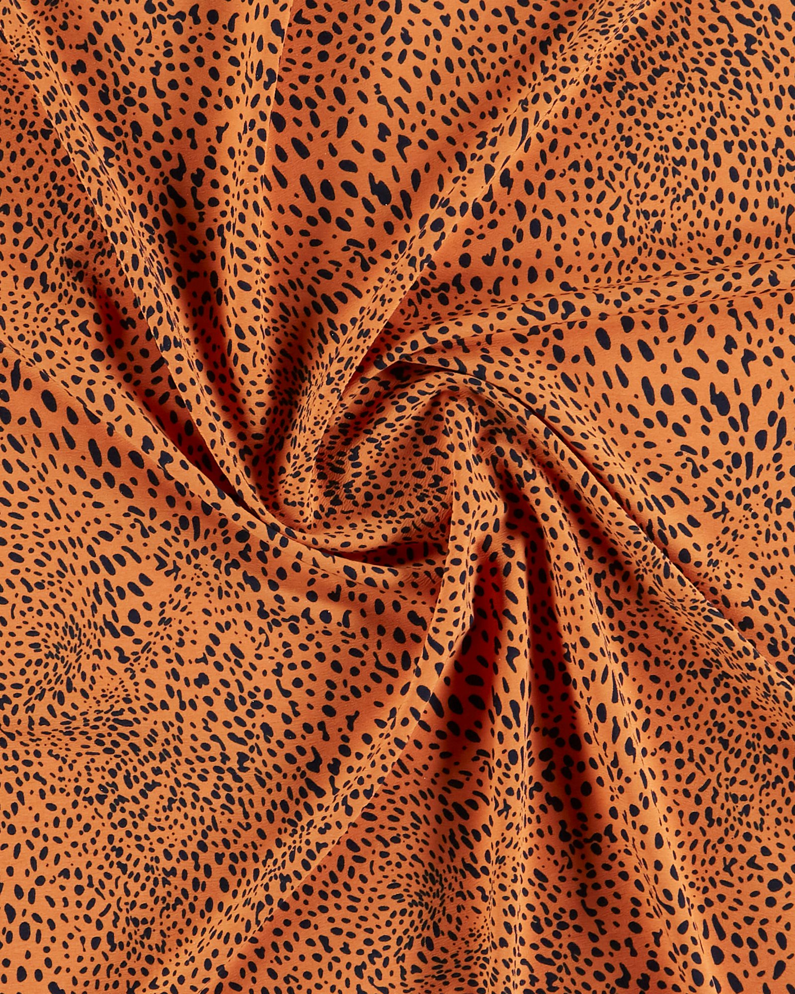 Woven crepe stretch orange w uneven dots 502094_pack